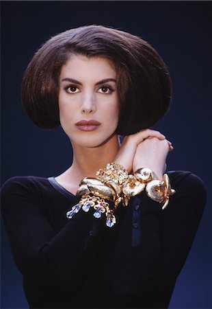 Portrait of Woman in Formal Wear and Showing Bracelets Foto de stock - Con derechos protegidos, Código: 700-03298813