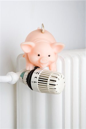 energy efficient - Piggy Bank on Radiator Dial Stock Photo - Rights-Managed, Code: 700-03298879