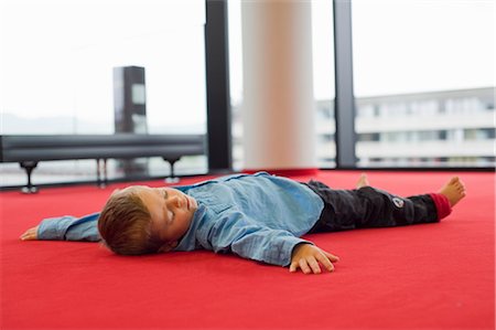 Little Boy Lying on Floor Stock Photo - Rights-Managed, Code: 700-03299220