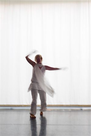 Woman Dancing in Front of a White Curtain, Salzburg, Salzburger Land, Austria Stock Photo - Rights-Managed, Code: 700-03299223