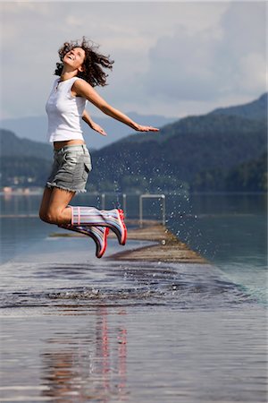 feeling good - Woman Jumping in Shallow Water, Fuschlsee, Salzburg, Austria Stock Photo - Rights-Managed, Code: 700-03333140