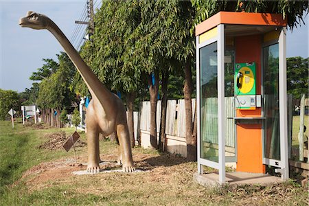 quirky - Dinosaur by Phone Booth, Nan, Nan Province, Thailand Stock Photo - Rights-Managed, Code: 700-03368777