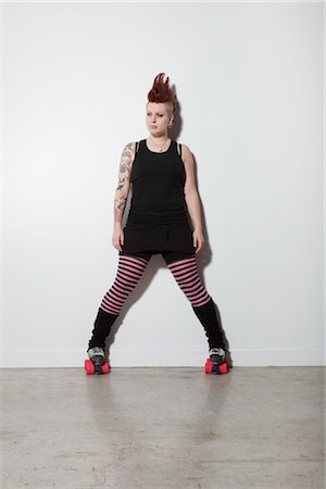 rebellious - Portrait of Woman on Roller Skates Foto de stock - Con derechos protegidos, Código: 700-03368821