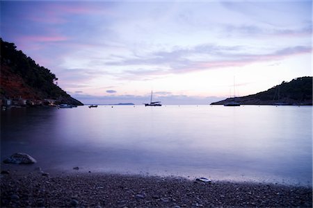 sailboat on the beach - Beach at Dusk, Cala Salada, Ibiza, Balearic Islands, Spain Stock Photo - Rights-Managed, Code: 700-03404312