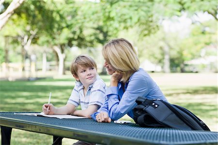 family outdoors candid - Mother and Son doing Homework in Park Stock Photo - Rights-Managed, Code: 700-03406474