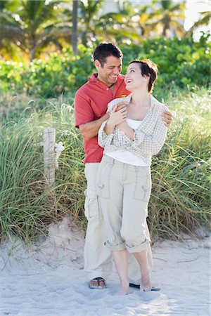 Couple Embracing on Beach Fotografie stock - Rights-Managed, Codice: 700-03407268