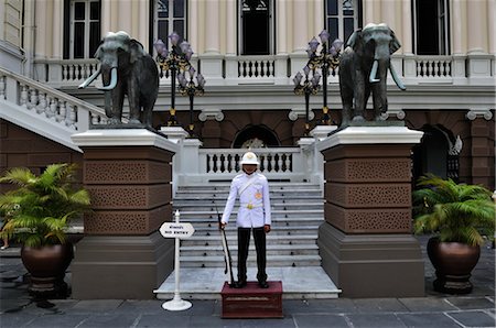 elephant standing on person - Guard at Grand Palace, Bangkok, Thailand Stock Photo - Rights-Managed, Code: 700-03407667