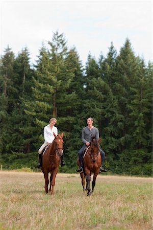 ecuestre - Couple Riding Horses, Brush Prairie, Washington, USA Foto de stock - Con derechos protegidos, Código: 700-03407779