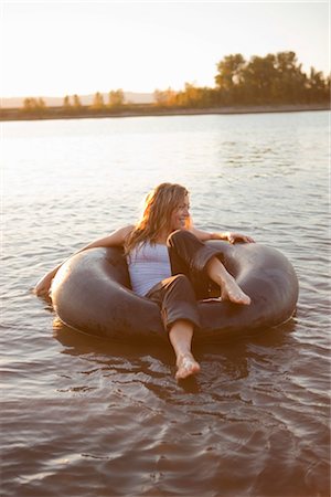 floating (person on water) - Woman on Inner Tube, Oregon, USA Stock Photo - Rights-Managed, Code: 700-03407887