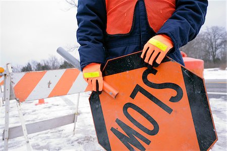 Construction Worker Holding Slow Sign Foto de stock - Con derechos protegidos, Código: 700-03408090