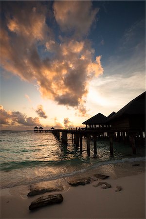 Wharf and Beach Huts at Sunset, The Beach House at Manafaru, Maldives Stock Photo - Rights-Managed, Code: 700-03403859