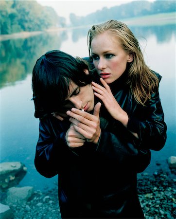 fashion model (male) - Couple By Lake, Man Lighting Cigarette Stock Photo - Rights-Managed, Code: 700-03438980