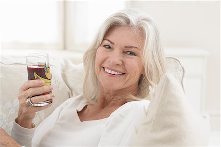 satisfied (thirst) - Woman Drinking a Glass of Juice Foto de stock - Con derechos protegidos, Código: 700-03439015