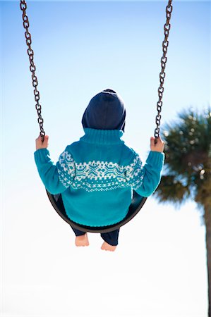 Boy on Swing, Hernando Beach, Florida, USA Foto de stock - Con derechos protegidos, Código: 700-03439227