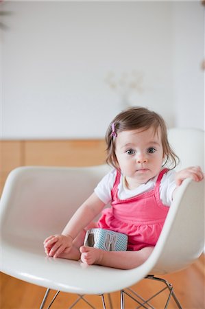 Baby Girl Sitting in a Rocking Chair Fotografie stock - Rights-Managed, Codice: 700-03439473