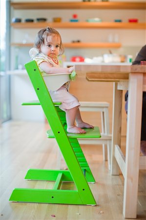 family eating dinner kitchen - Baby Girl in Her High Chair on Her First Birthday Stock Photo - Rights-Managed, Code: 700-03439485