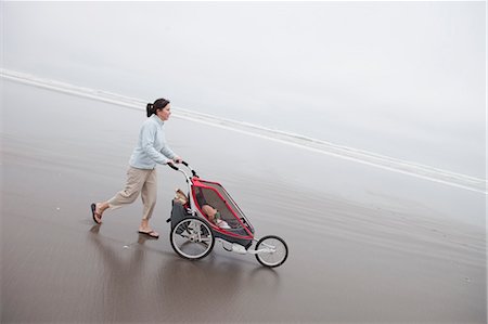 stroller - Mother and Daughter Walking on the Beach, Near Seaside, Oregon, USA Stock Photo - Rights-Managed, Code: 700-03439502