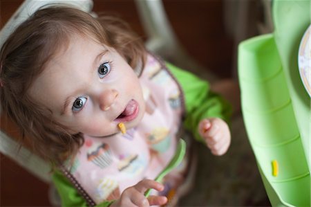 Overhead View of Little Girl Eating Lunch Fotografie stock - Rights-Managed, Codice: 700-03439544