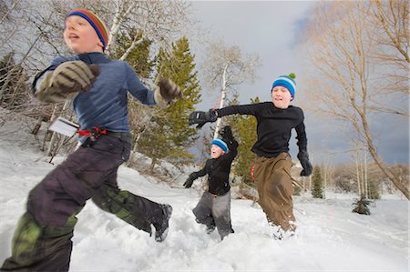 snow covered boy - Brothers Running in Snow, Steamboat Springs, Colorado, USA Stock Photo - Rights-Managed, Code: 700-03439889