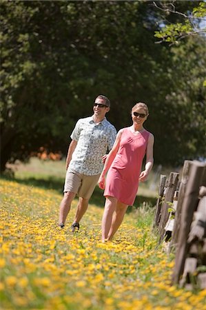 simsearch:700-03017734,k - Couple Walking Through a Field of Yellow Wildflowers, Near Santa Cruz, California, USA Stock Photo - Rights-Managed, Code: 700-03439973