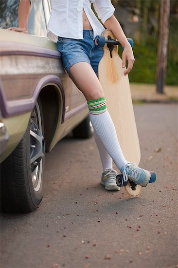 Woman Holding Skateboard, Portland, Oregon, USA Stock Photo - Premium Rights-Managed, Artist: Ty Milford, Image code: 700-03439990