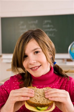 schoolchild eat - Girl Eating Lunch in School Stock Photo - Rights-Managed, Code: 700-03445049