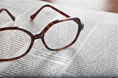 eyeglasses and newspaper - Eyeglasses on Newspaper Stock Photo - Rights-Managed, Code: 700-03445571