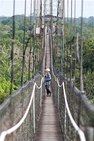 south america jungle pictures - Boy on Footbridge, Sacha Lodge, Quito, Ecuador Stock Photo - Rights-Managed, Code: 700-03445676