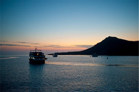 dawn to dusk - Boat near Bartolome Island, Galapagos Islands, Ecuador Stock Photo - Rights-Managed, Code: 700-03445936
