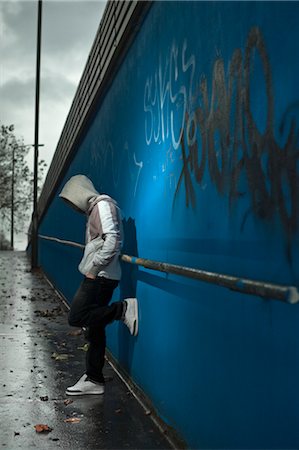 sad picture of a teenage boy alone - Teenager Wearing Hoodie Leaning Against Wall Stock Photo - Rights-Managed, Code: 700-03446057