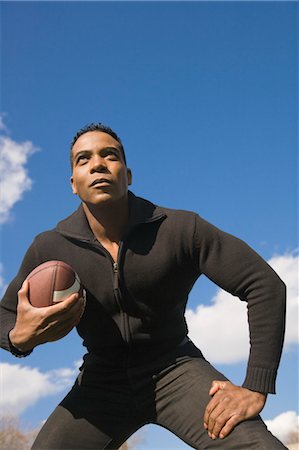 pelota (de fútbol americano) - Man Playing American Football Foto de stock - Con derechos protegidos, Código: 700-03446121