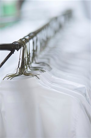 simsearch:700-01042051,k - White Shirts Hanging on Hangers Foto de stock - Con derechos protegidos, Código: 700-03446175