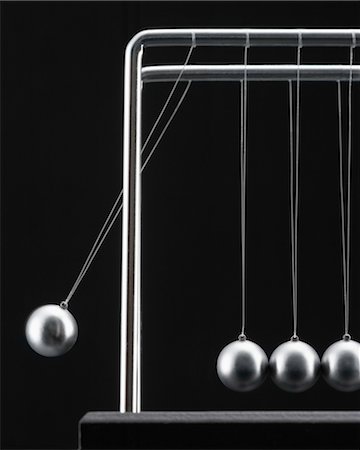 physics - Close-up of Newton's Cradle Stock Photo - Rights-Managed, Code: 700-03448792