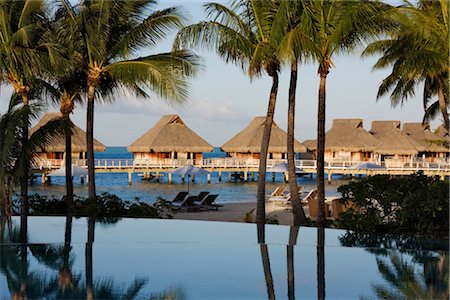 pool chairs - Swimming Pool and Huts, Bora Bora Nui Resort, Bora Bora, Tahiti, French Polynesia Stock Photo - Rights-Managed, Code: 700-03440200