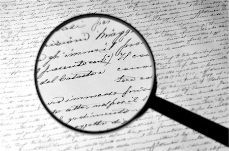 Magnifying Glass Englarging Handwritten Document Stock Photo - Rights-Managed, Code: 700-03456359