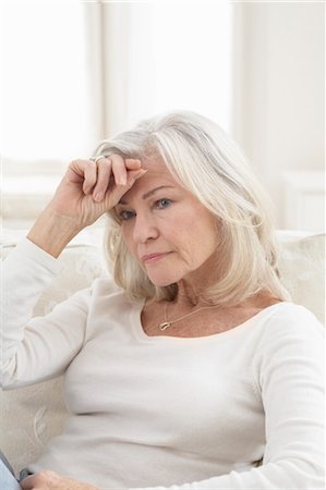 stressed old people - Woman Holding Forehead Stock Photo - Rights-Managed, Code: 700-03456362