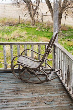 peeling (outer layer detaching itself) - Rocking Chair on Porch, Kansas, USA Stock Photo - Rights-Managed, Code: 700-03456378