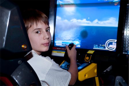 Boy Playing Arcade Game Stock Photo - Rights-Managed, Code: 700-03456768