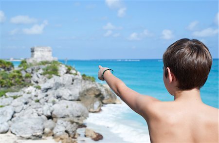 rocky coast person - Boy Pointing at Temple, Tulum, Mexico Stock Photo - Rights-Managed, Code: 700-03456780
