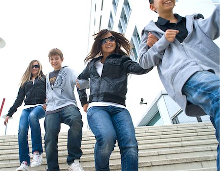 simsearch:614-06898440,k - Teenagers Running Down Stairs Stock Photo - Rights-Managed, Code: 700-03456800