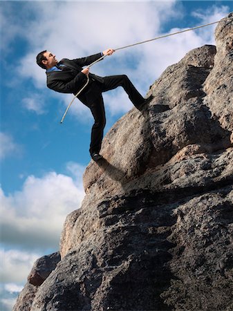 dangerous rock climbing - Businessman Climbing up Cliff Stock Photo - Rights-Managed, Code: 700-03466497