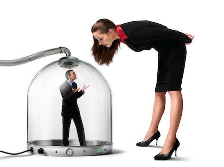Businesswoman looking at Businessman inside of Pressurized Glass Dome Stock Photo - Rights-Managed, Code: 700-03466503