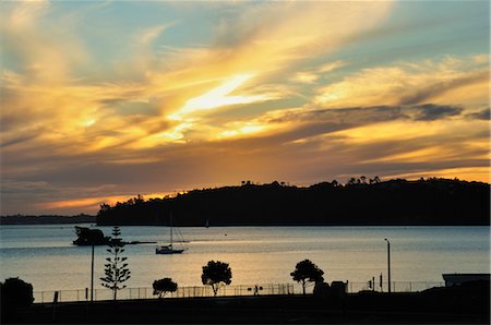 sailboat silhouette - Sunset, Waitemata Harbour, Auckland, North Island, New Zealand Stock Photo - Rights-Managed, Code: 700-03508288