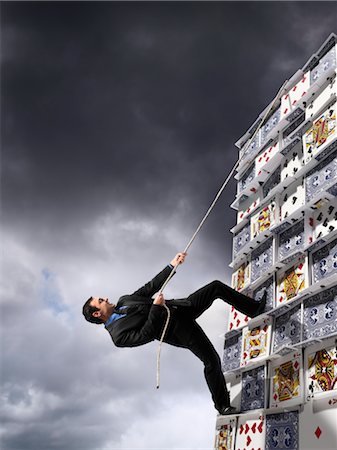 Businessman Climbing House of Cards Stock Photo - Rights-Managed, Code: 700-03502995