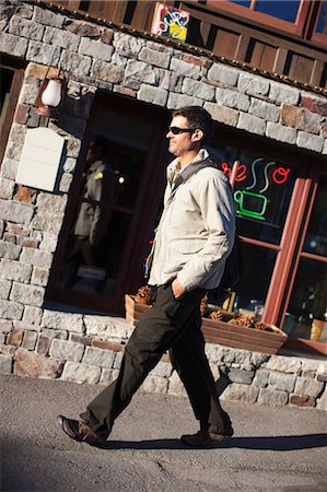 profile view of someone walking - Man Walking Past Cafe, Truckee, near Lake Tahoe, California, USA Stock Photo - Rights-Managed, Code: 700-03503032