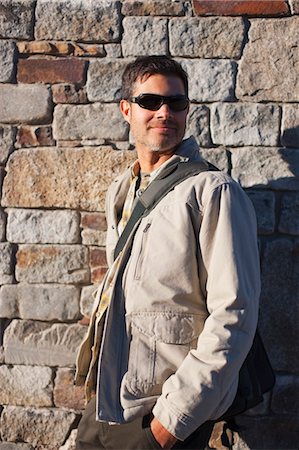 Man Standing by Brick Wall, Truckee, near Lake Tahoe, California, USA Stock Photo - Rights-Managed, Code: 700-03503033