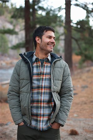 Smiling Man in Forest, Truckee, near Lake Tahoe, California, USA Foto de stock - Con derechos protegidos, Código: 700-03503043