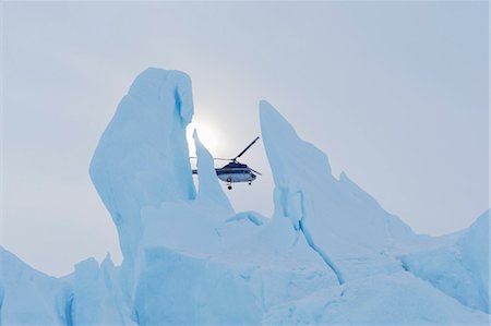 Helicopter Flying Behind Iceberg, Snow Hill Island, Antarctic Peninsula, Antarctica Stock Photo - Rights-Managed, Code: 700-03503084