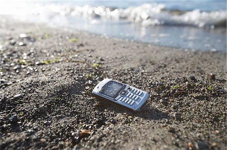Handy am Strand Stockbilder - Lizenzpflichtiges, Bildnummer: 700-03519233