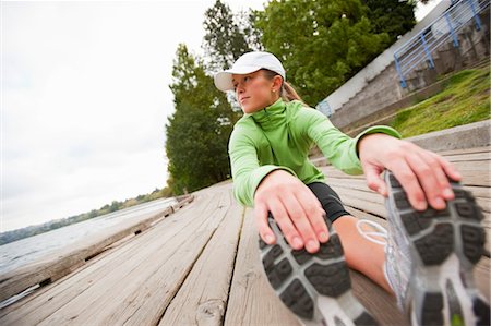 Woman Stretching after Workout, Green Lake Park, Seattle, Washington, USA Foto de stock - Con derechos protegidos, Código: 700-03554449